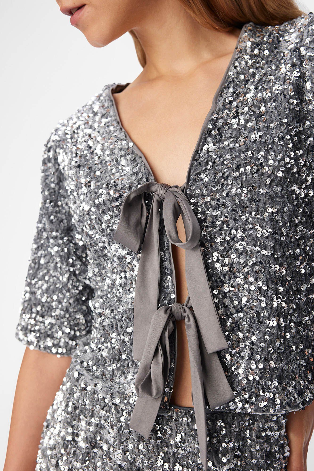 Object Top de lantejoulas com la&ccedil;os.