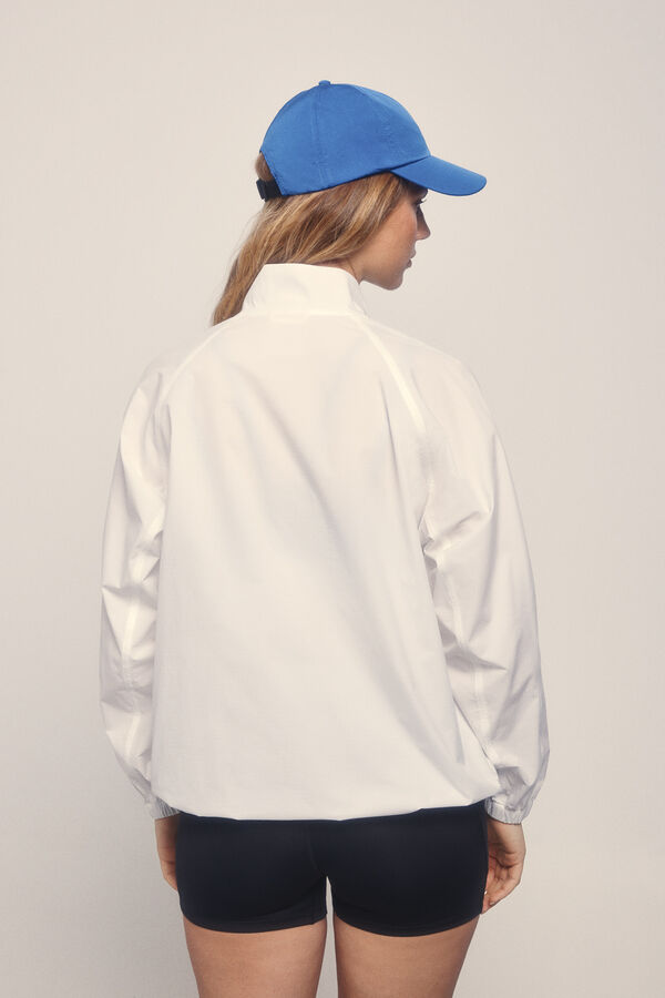 Dash and Stars Chaqueta cortavientos bolsillo canguro beige