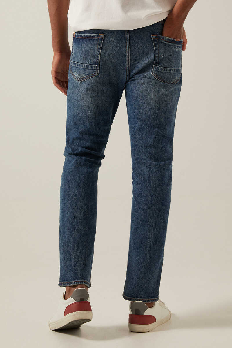 Springfield Jeans slim lavado medio oscuro con rotos turquesa