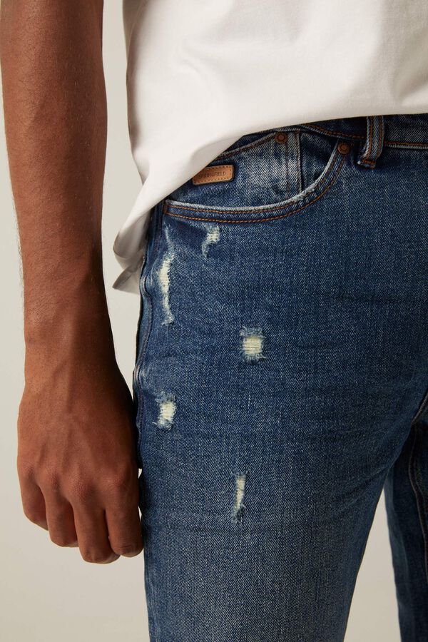 Springfield Jeans slim lavagem média-escura com rasgões violeta