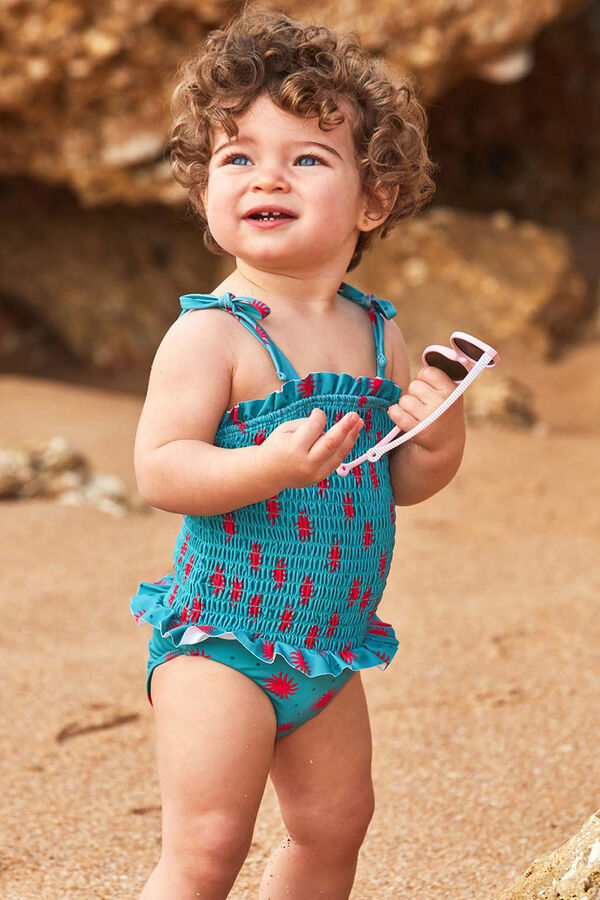 Gocco Ba&ntilde;ador smock de soles azul claro turquesa